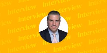 Headshot of Bernardo M. Cremades, Jr. against yellow background